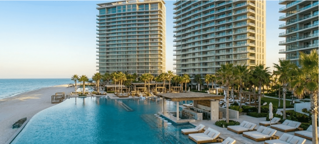 Encantame Towers infinity pool with swim-up bar and ocean views