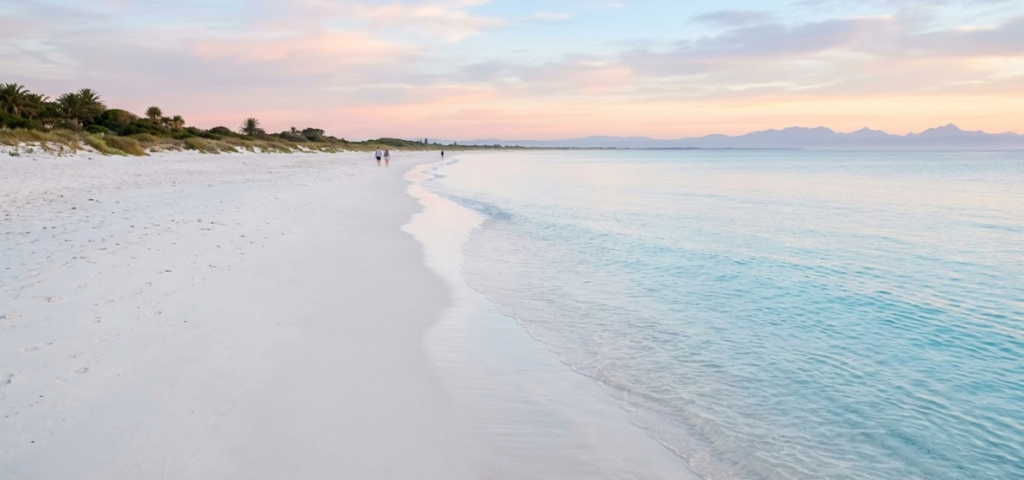 Smooth fine-sand shoreline at Playa Encanto Puerto Peñasco Mexico with calm shallow Sea of Cortez water